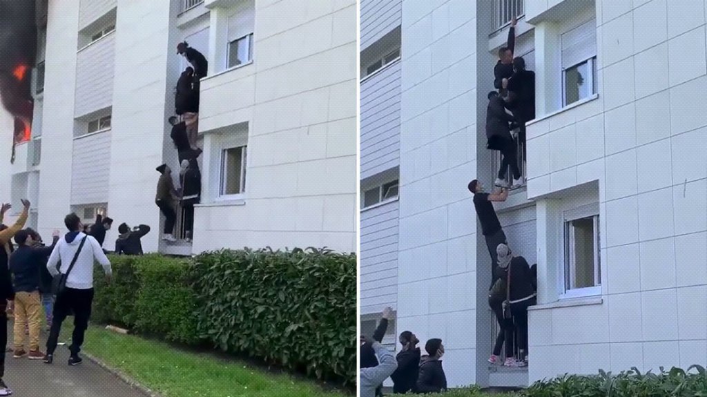  VIDEO: Decenas de j&oacute;venes forman una escalera humana para rescatar a una familia de un edificio en llamas 